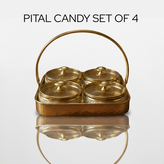 A beautifully crafted pital candy box set with three round containers having pearl borders with matching lids, neatly arranged in a hammered brass tray with a decorative handle. 