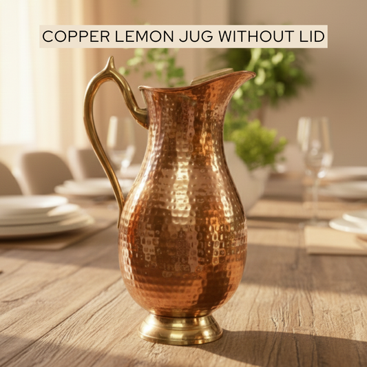 Copper lemon jug without lid placed on a table weighs 900gms